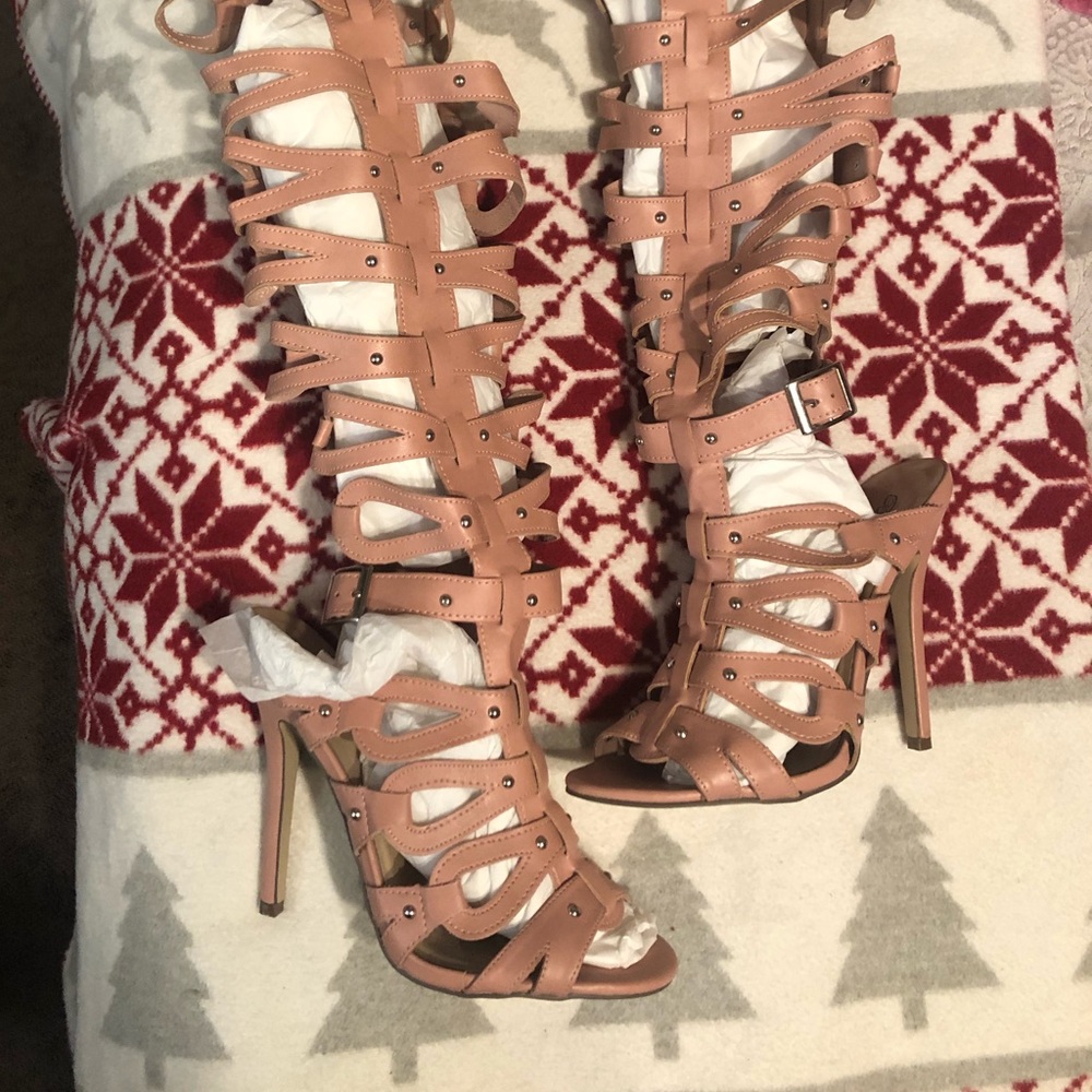 Over the knee, buckle/strap heels.